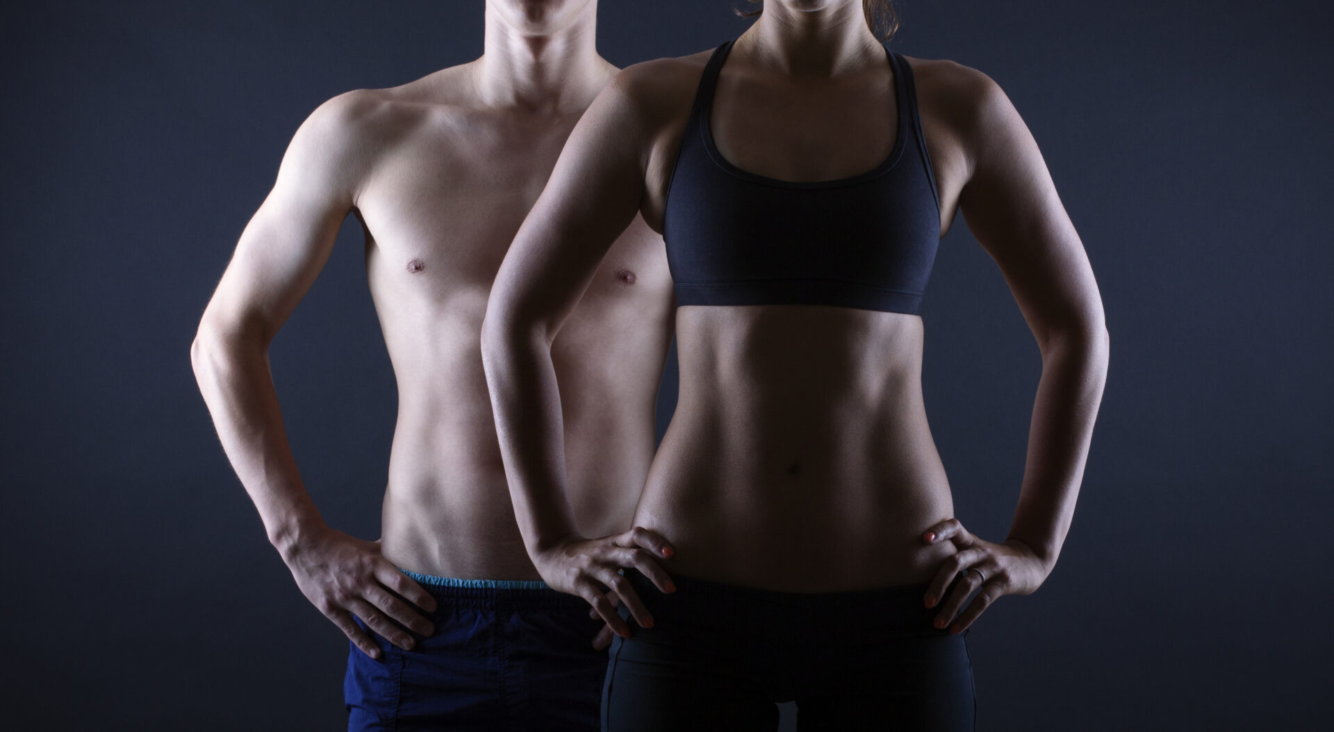 Man,And,Woman's,Torso,Isolated,On,A,Black,Background